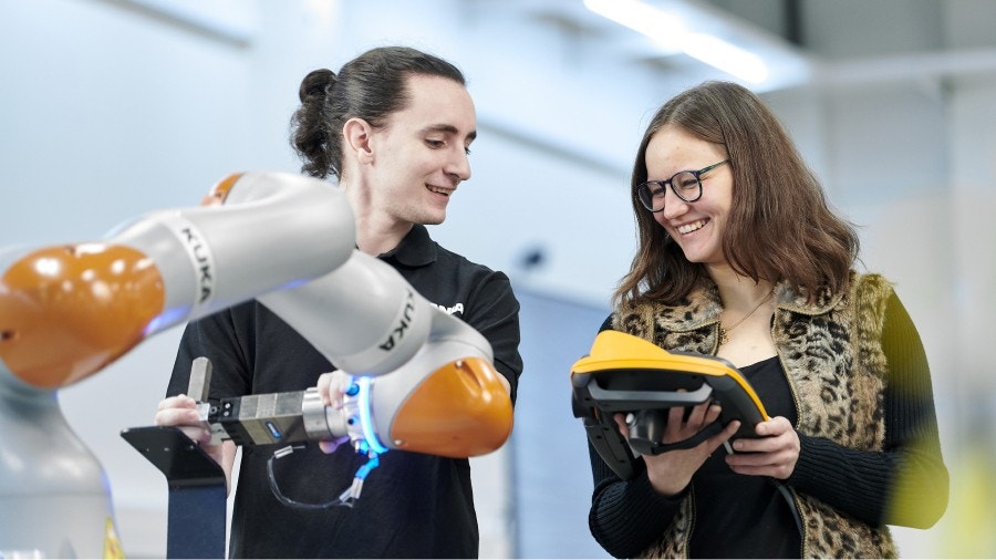 KUKA Robot with two testing engineers