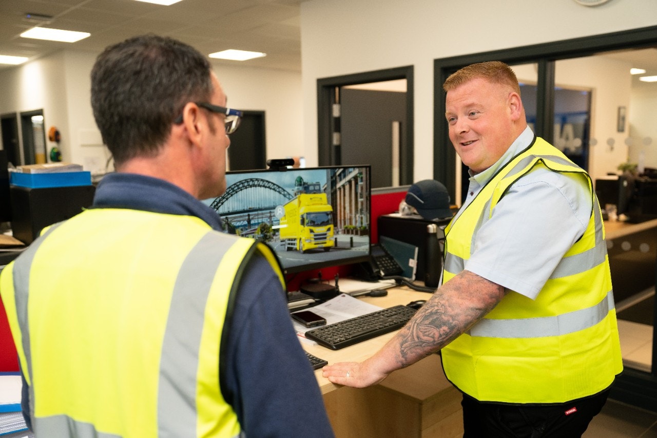  Ged Nairn, Workshop Services Manager at Eurocentral talking to colleauge in workshop office