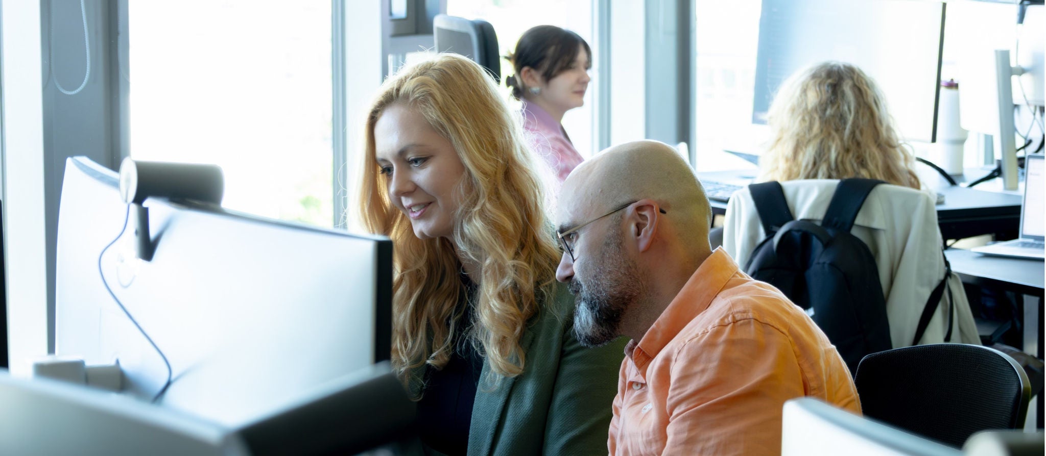 Office-staff-in-front-of-screen
