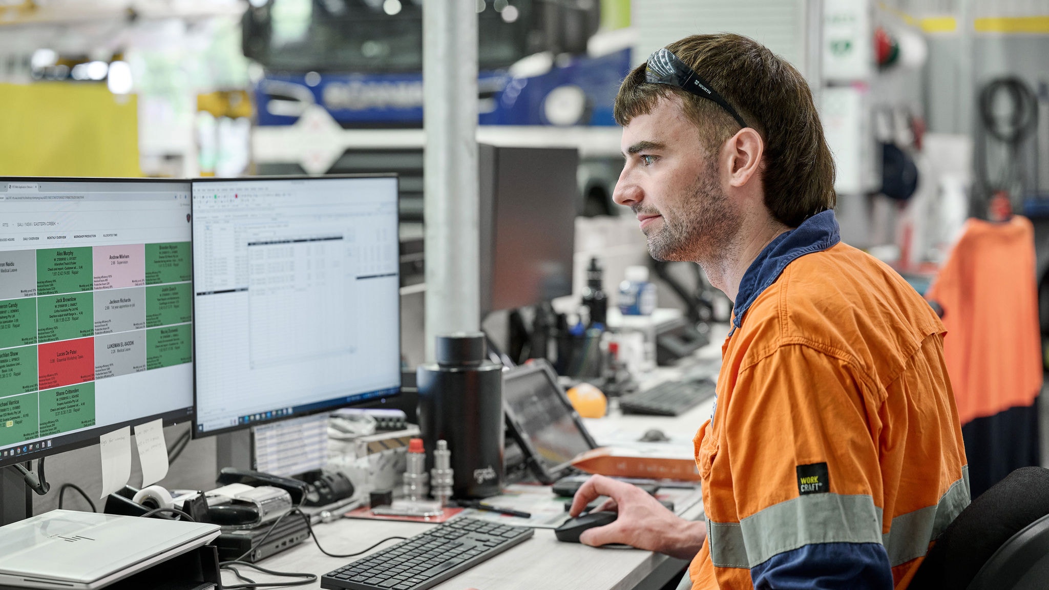 A Scania service technician working at a computer