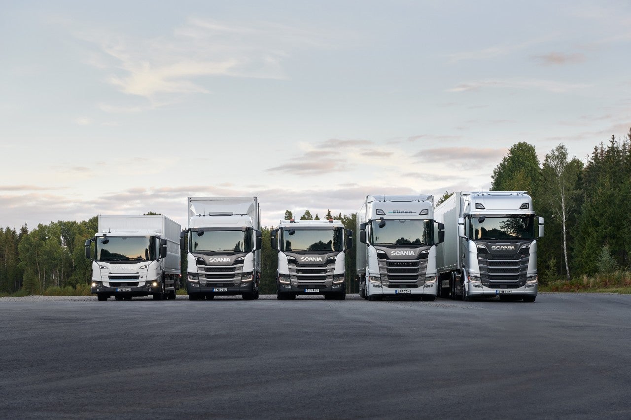 Scania L series driving down small town road