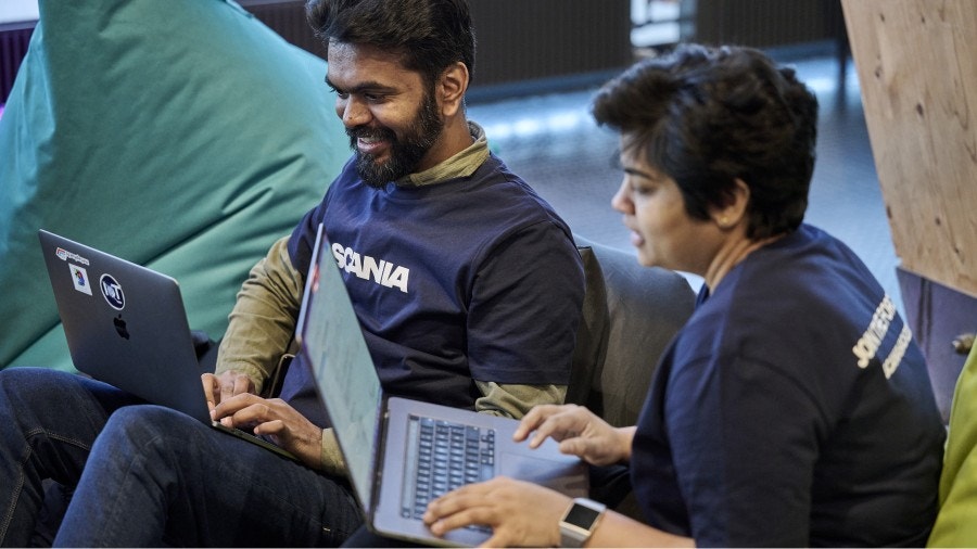 Two software engineers working on their code
