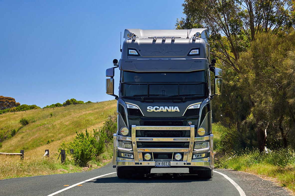Scania truck driving on a road