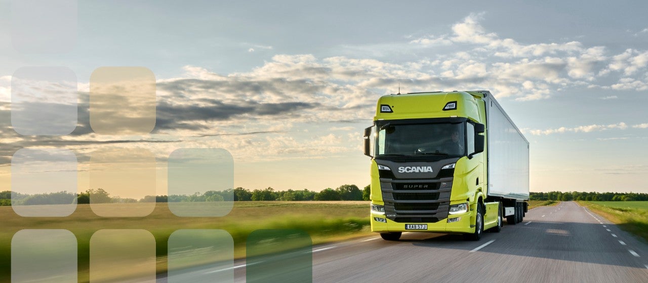 Yellow Scania Super tractor unit pulling trailer