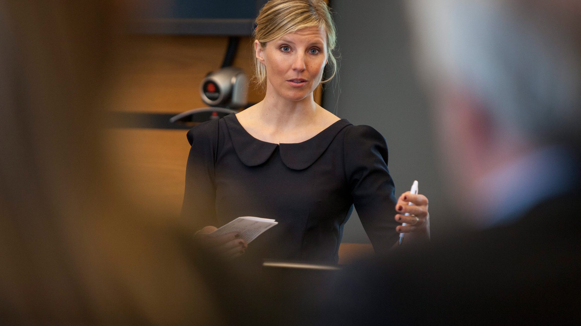 A woman speaking a podium A woman speaking a podium