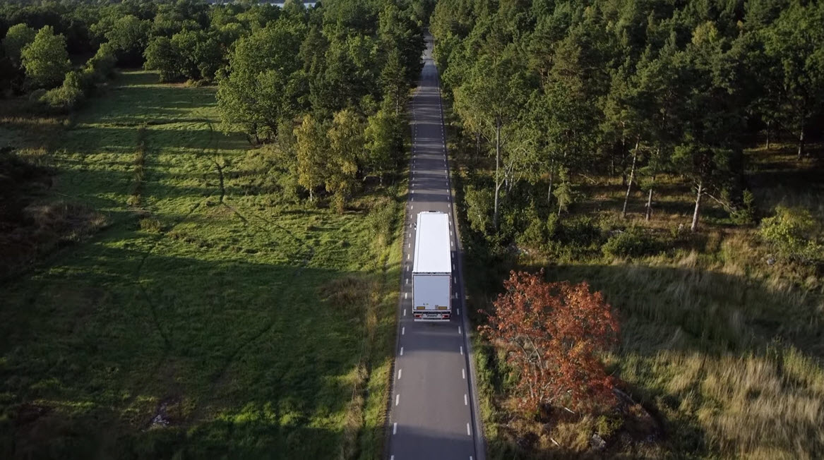 A Scania truck driving through the countryside A Scania truck driving through the countryside