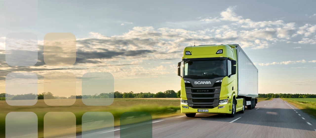 Yellow Scania Super tractor unit pulling trailer