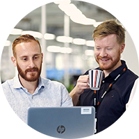 Two men in front of a computer
