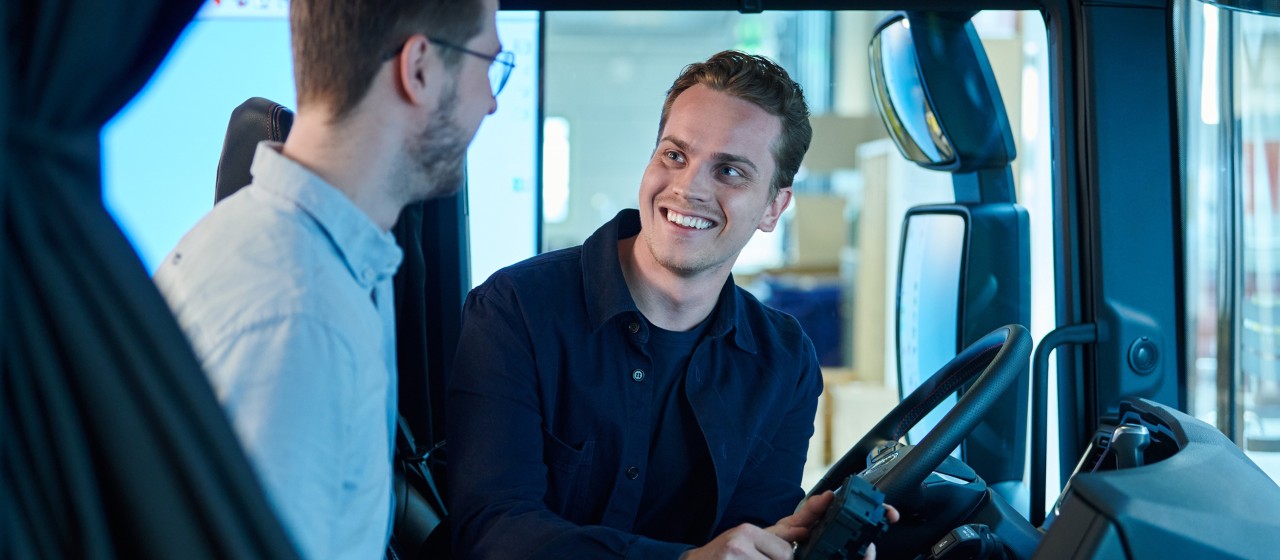 Two students in a Scania cab