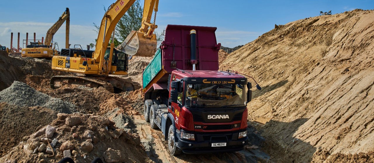 Incredible heavy machinery lifting tracked dumper off train tunnel moved by  powerful Scania XT 