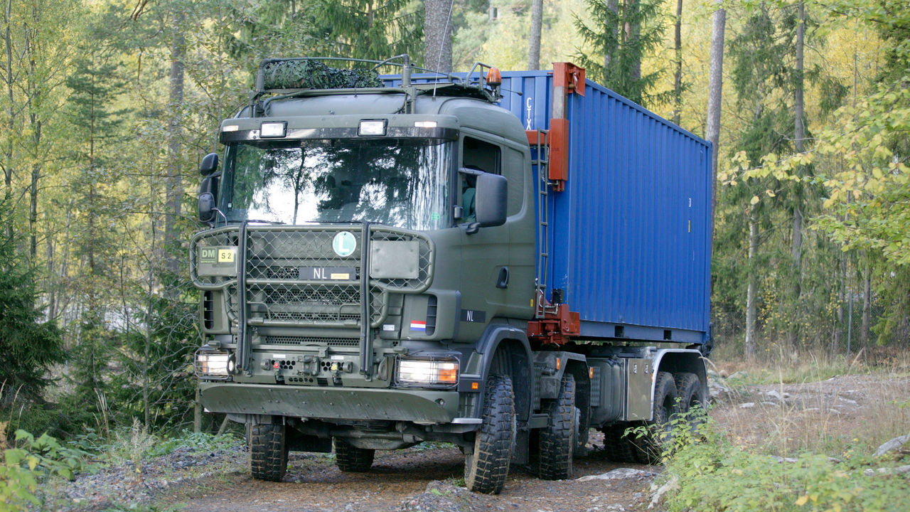An 8x8 container hooklift Scania truck 