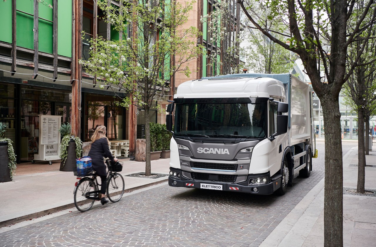 Scania L-series low-entry cab truck driving on small street 