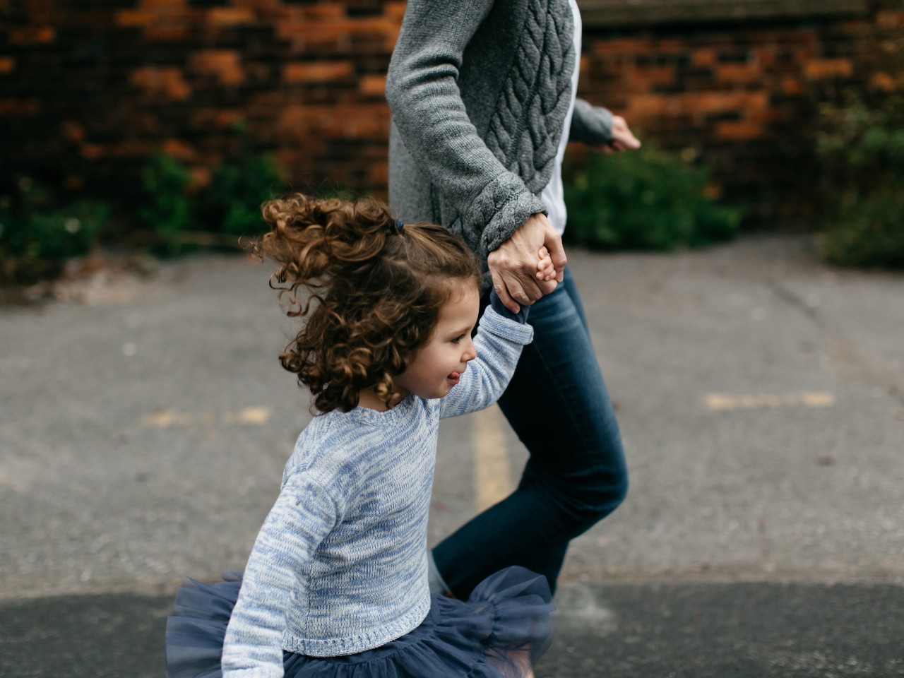 Kid and grown up out walking