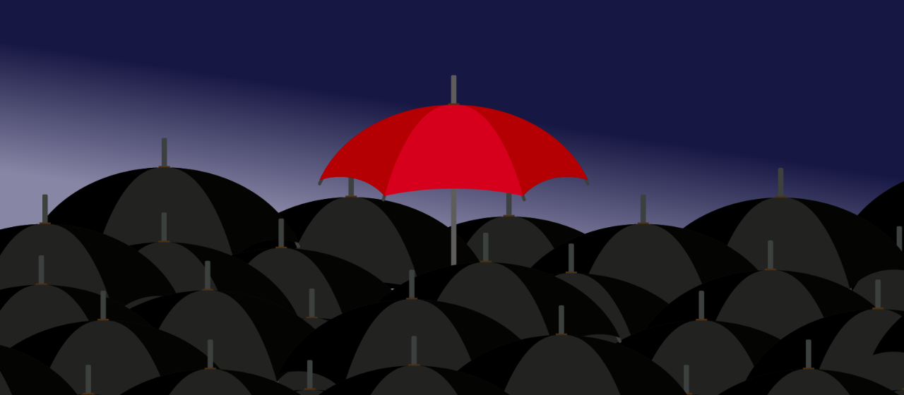 Loads of open grey umbrella's and a single red umbrella