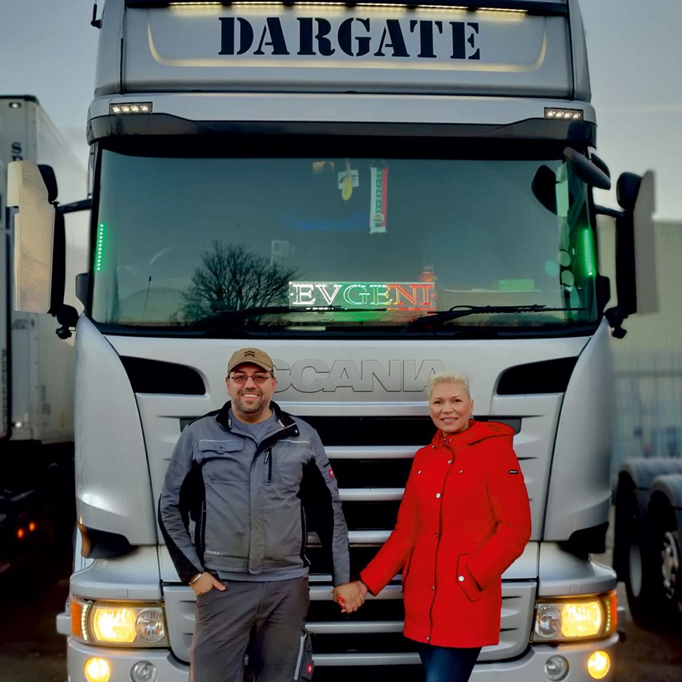 Stefan and his wife infront of a Scania