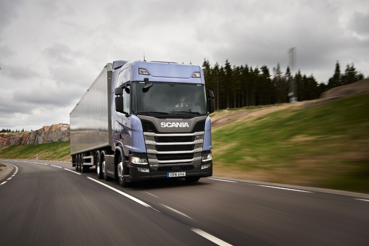 Scania truck driving on quiet road