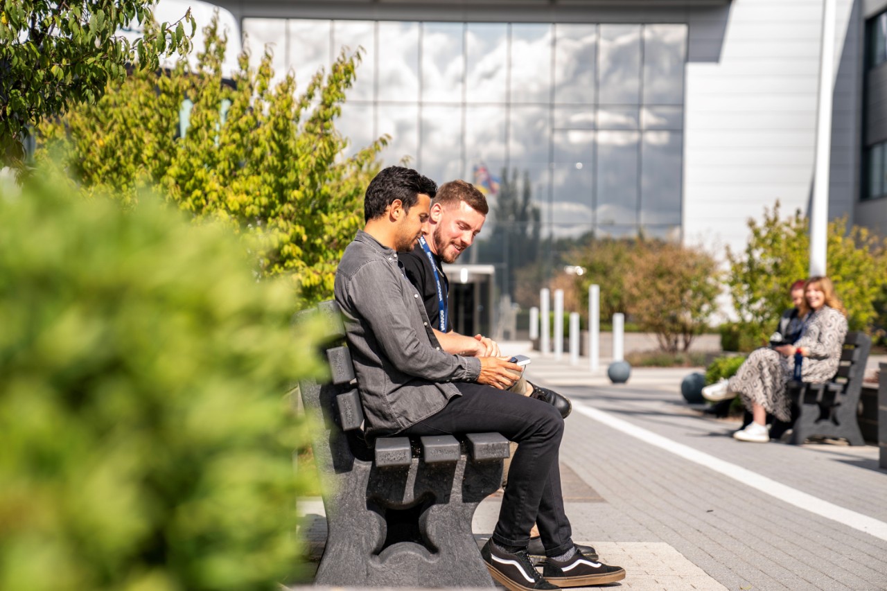 Scania team standing by bench outside of Milton Keynes head office