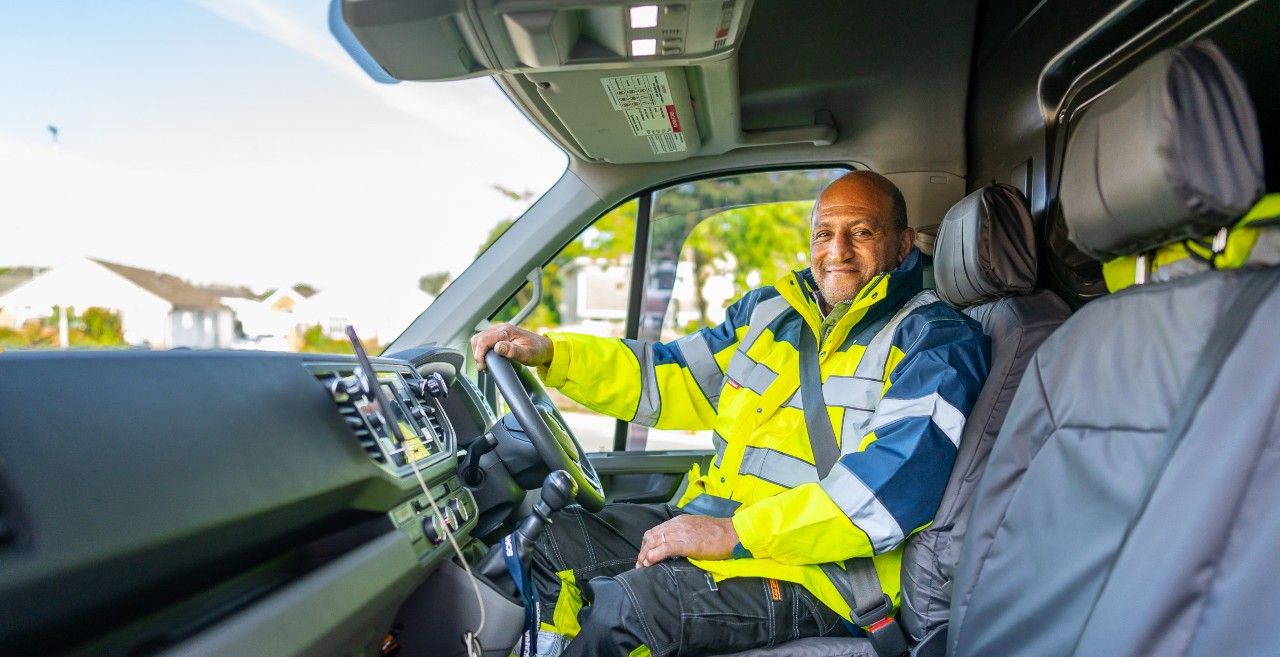 Scania Assistance technician sat in van smiling