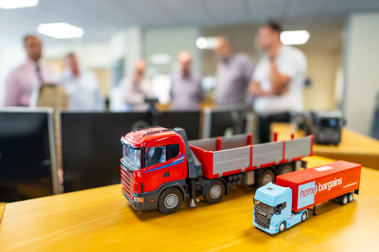 Toy model trucks on desk