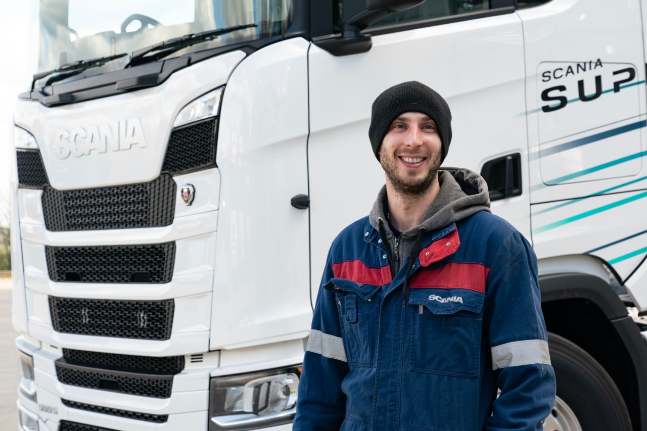 Scania truck with colleauges in background