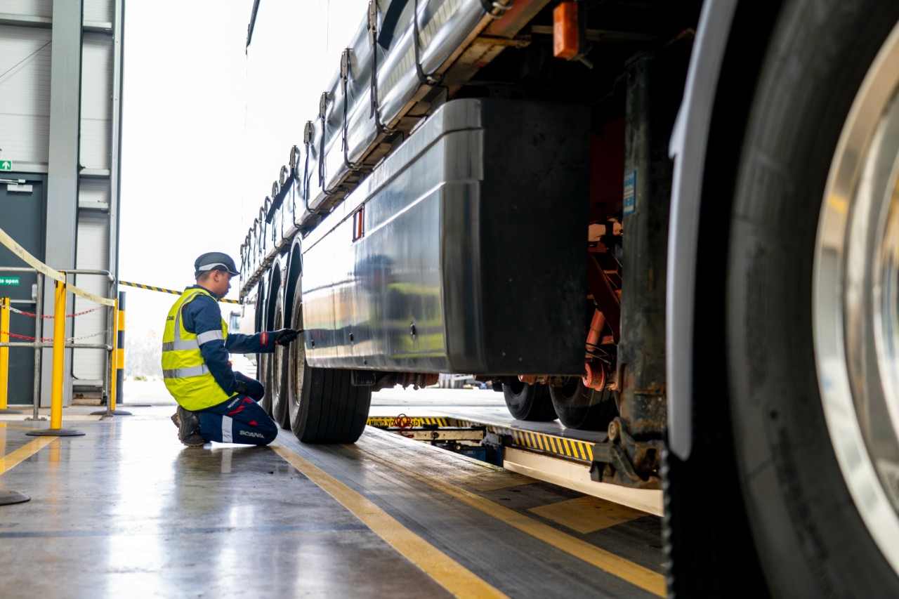 Technician working on Scania truck