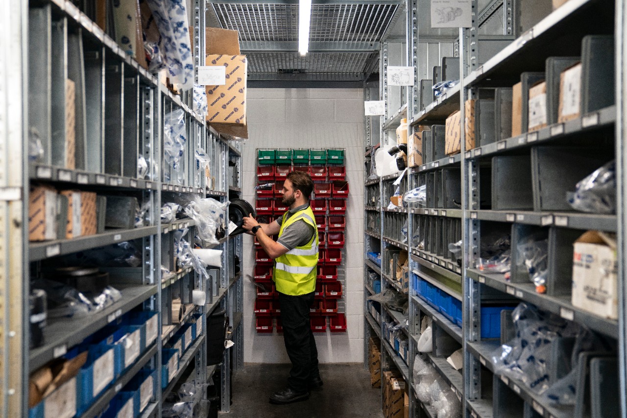 scania workshop - two workers look at a part