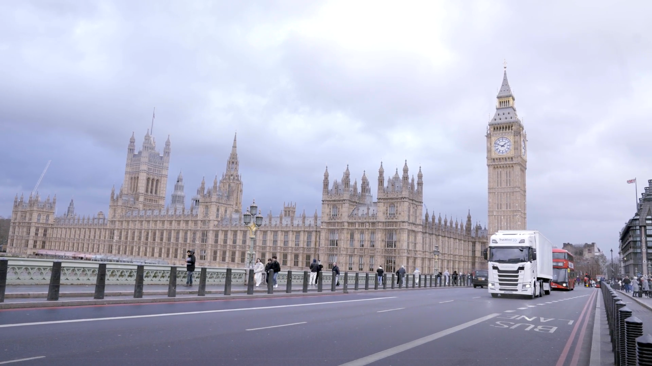 London scene with Scania driving past Big Ben