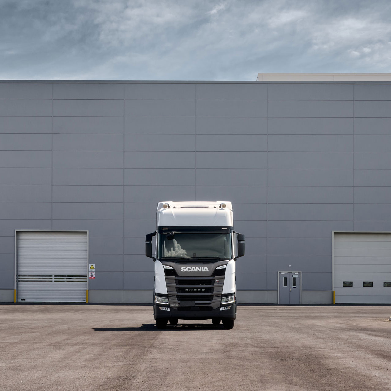 A white Scania 500 R Super truck, parked outside of Scania's new global industrial hub in Rugao, China.