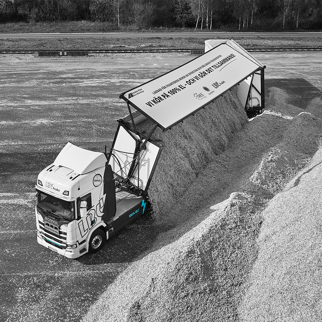 An electric Scania woodchip truck.